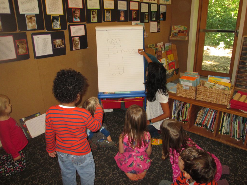 Language Arts Coordinator Rossana Zapf demonstrated during writing workshop how she might begin to tell and illustrate a story. 
